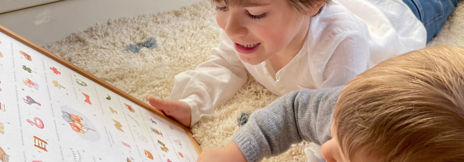 Children looking at My Baby Days print